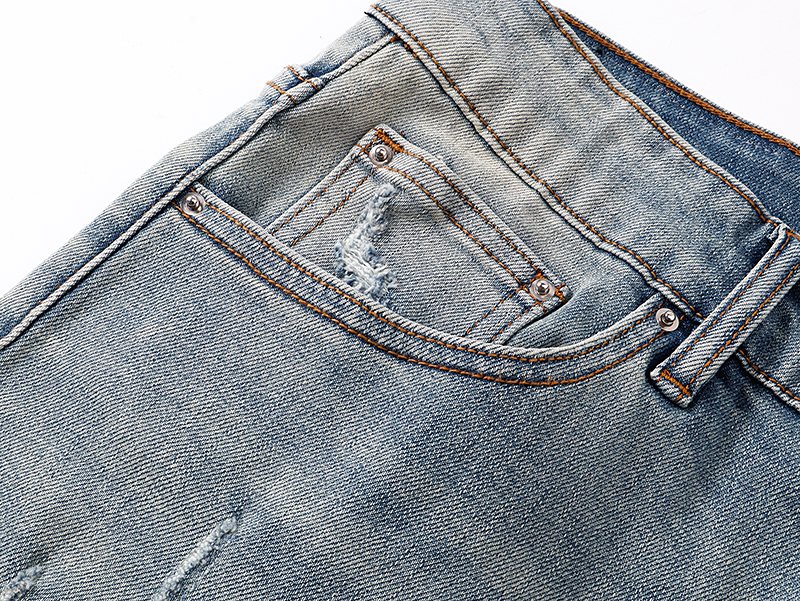 AMIRI Light Blue Distressed Monogram Denim Shorts — detail