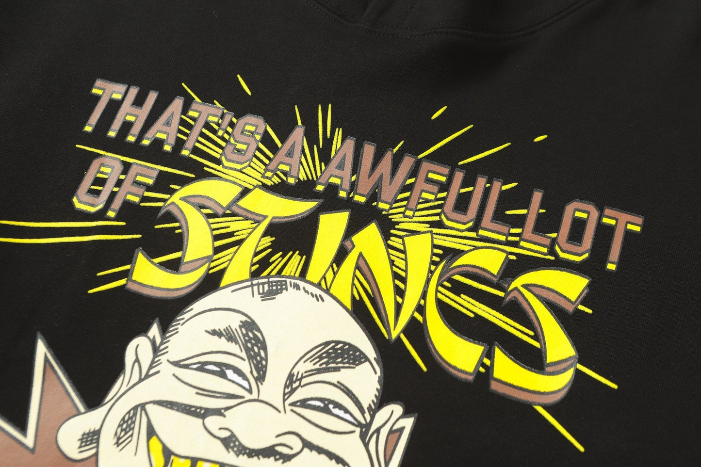 THAT'S A AWFUL LOT OF COUGH SYRUP Stings Character Graphic Hoodie — detail